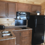 Deluxe Cabin 7 Lodging Steel Wheel Campground Kitchen